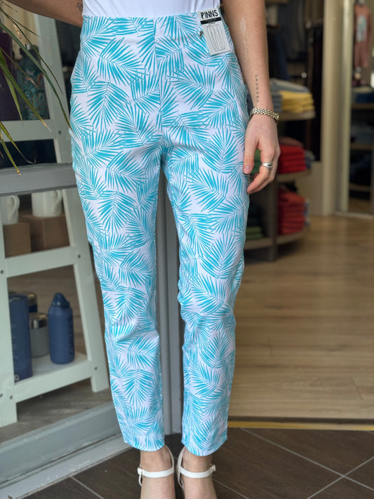 Person wearing blue and white patterned pants in an indoor setting.