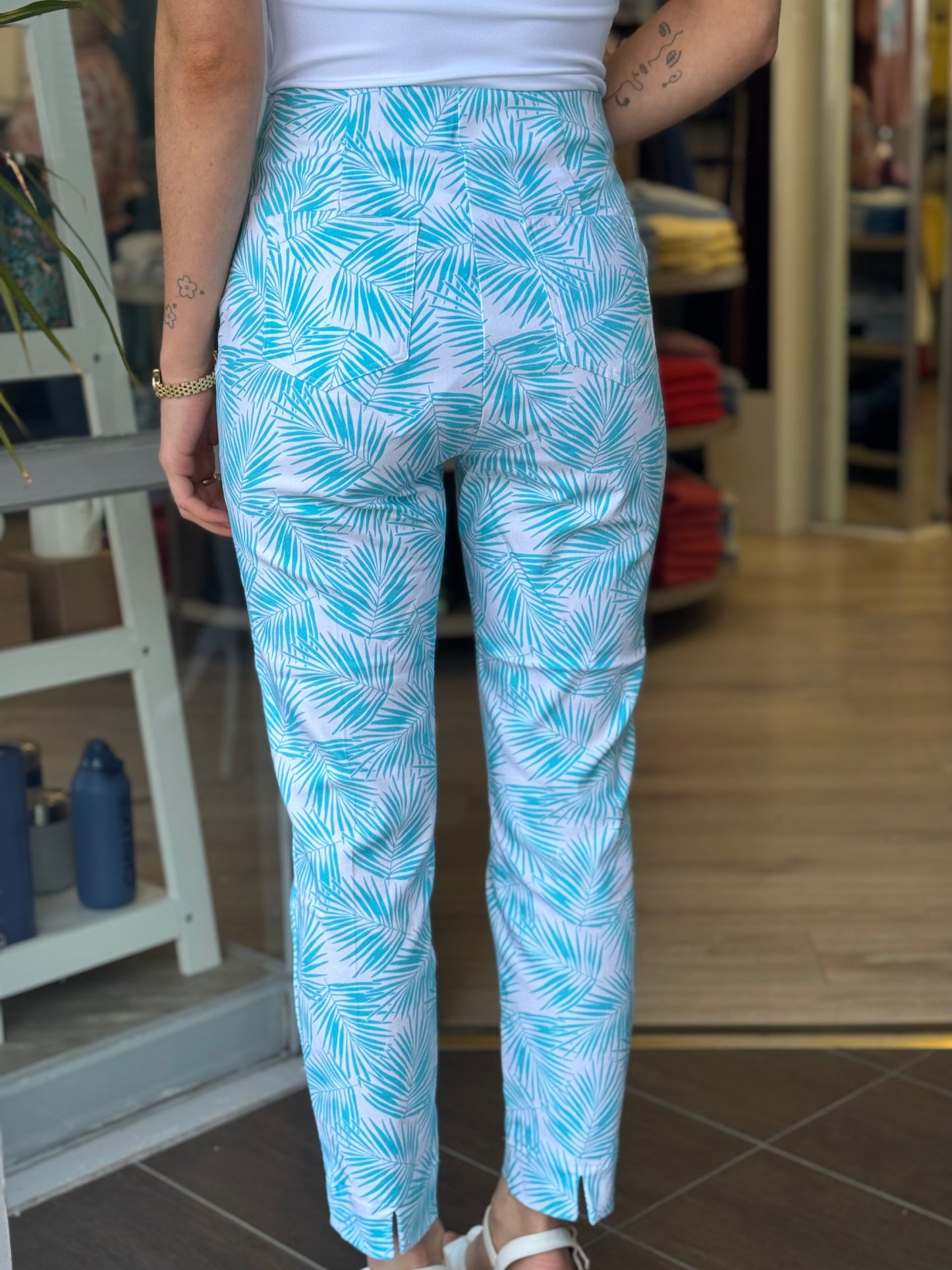 Person wearing blue and white patterned pants in a store setting