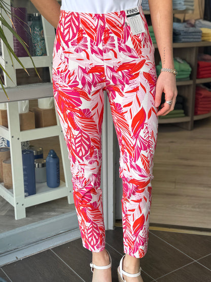 Person wearing red and white patterned pants in a store setting