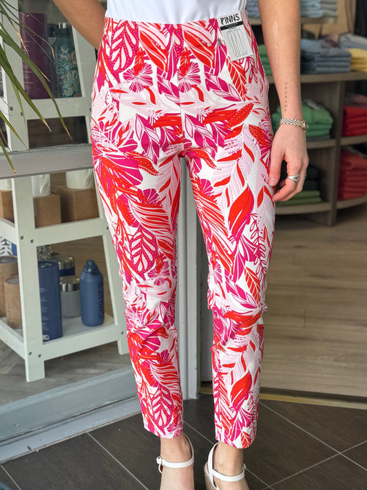 Person wearing red and white patterned pants in a store setting