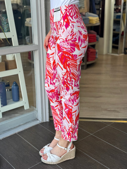 Person wearing red and white patterned pants in a store setting