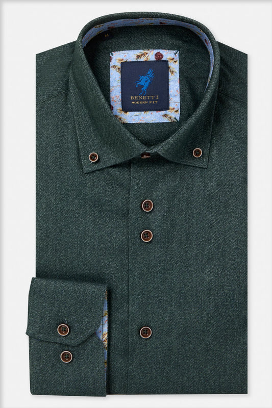 A folded dark green tweed dress shirt by Bennett of London, featuring a button-down collar, brown buttons, and a patterned inner lining visible at the collar and cuff.