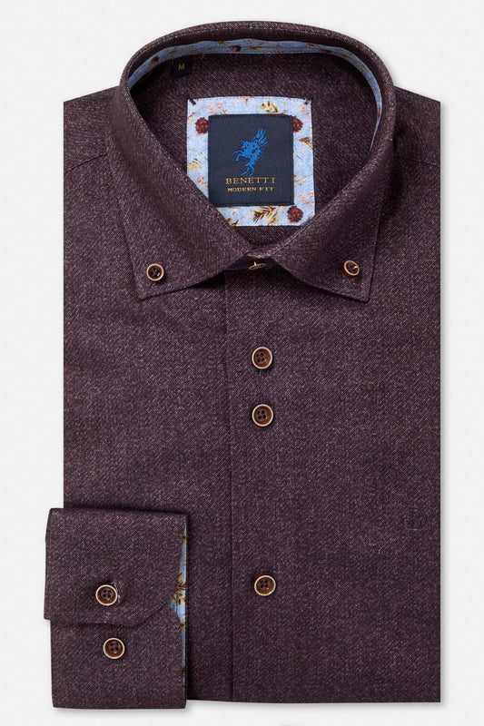 A folded men's dress shirt in a dark plum purple herringbone fabric, featuring a patterned inner collar and a visible Benetti Milano neck label.