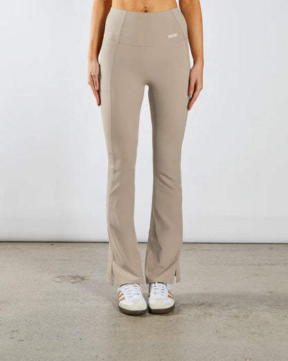 Woman wearing beige workout flare leggings - Front image