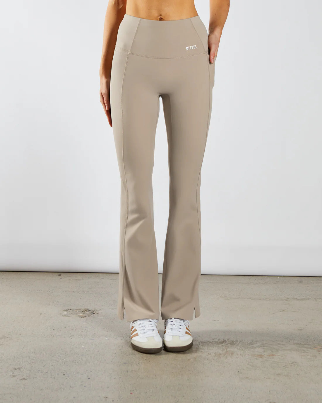 Woman wearing beige workout flare leggings - Front image