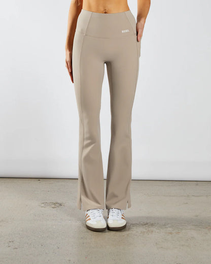 Woman wearing beige workout flare leggings - Front image