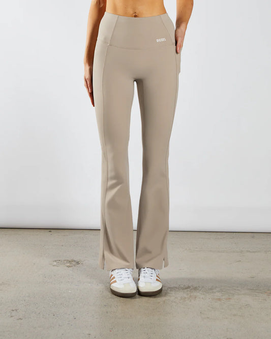 Woman wearing beige workout flare leggings - Front image