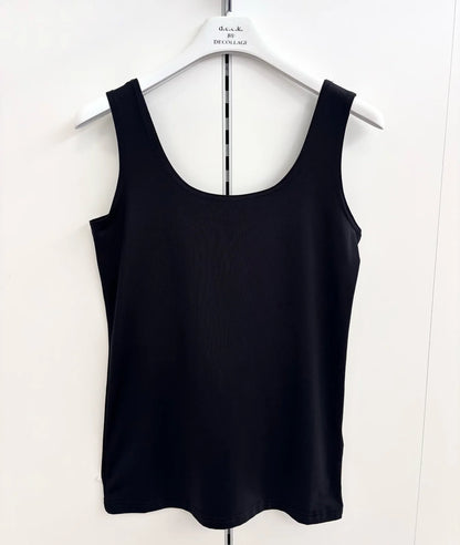 Black tank top on a white hanger against a white background