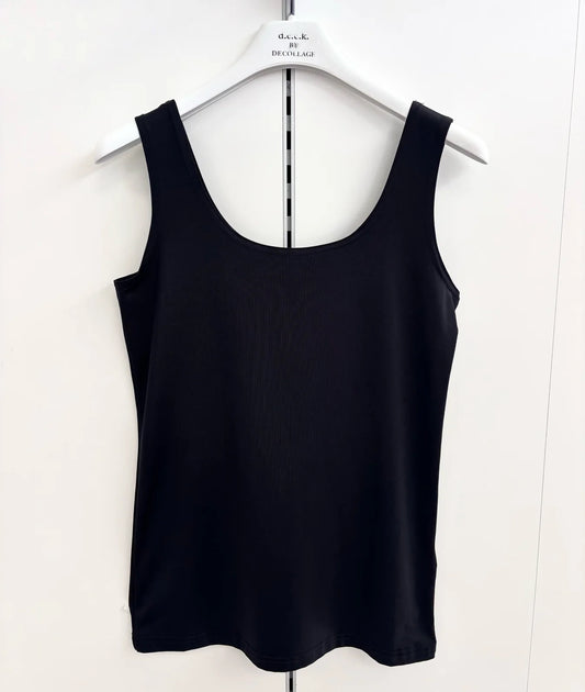 Black tank top on a white hanger against a white background