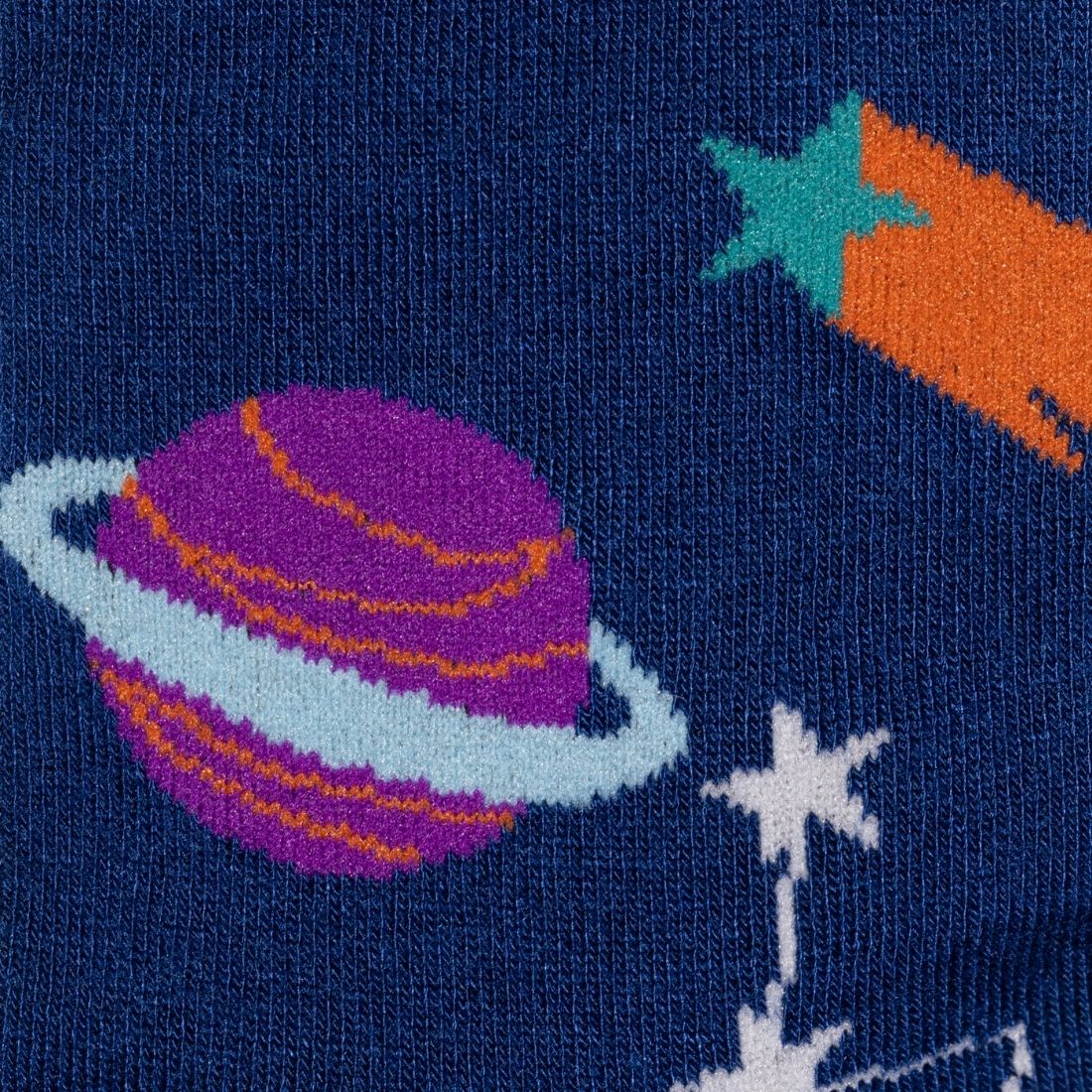 Space-themed sock with a purple planet, orange rocket, and white star on a dark blue background.