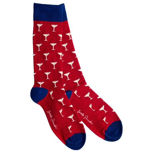 Red socks with white martini glass pattern and blue toes and cuffs on a white background
