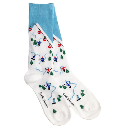 Socks with skiing design and blue top on a white background