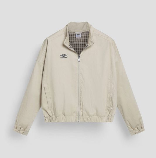 Beige jacket with plaid lining on a light gray background