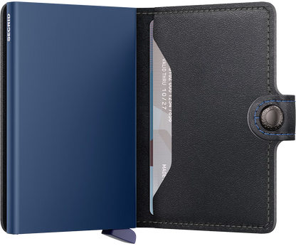 Blue and black leather cardholder with a visible brand name on a white background