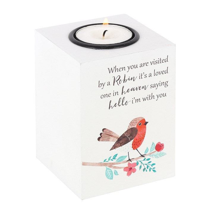 Candle holder with a robin illustration and text on a white background