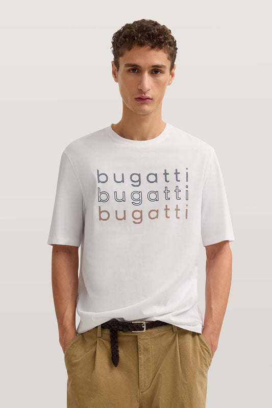 Man wearing a white t-shirt with 'bugatti' print on a light background